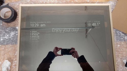view of smart mirror project in progress with hdmi monitor content coming through the glass